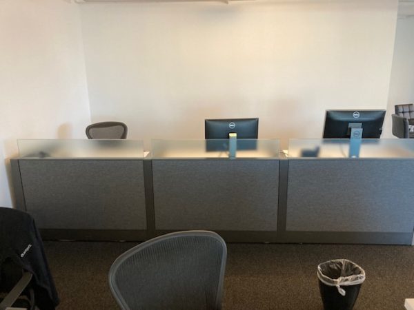 Ledger X Knoll Sit/Stand Desks set up as reception desk