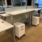 white sit/stand trading desks front view after installation