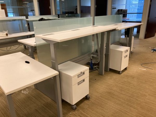 white sit/stand trading desks front view after installation