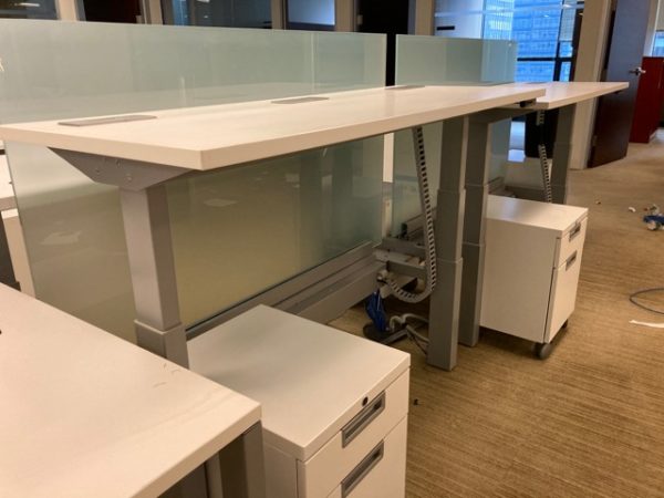 white sit/stand trading desks installed front view