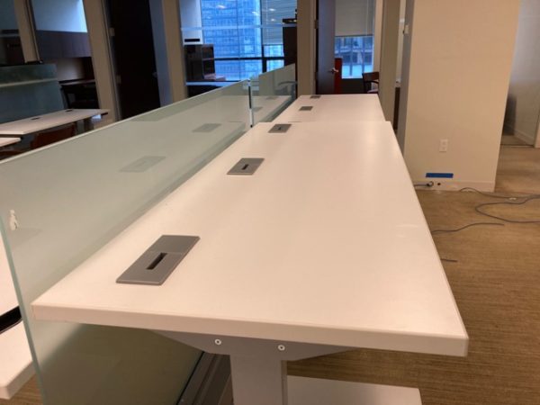 white sit/stand trading desks installed
