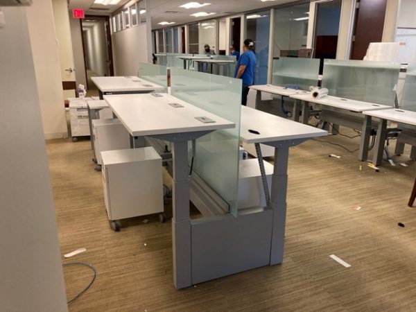 sit/stand trading desks being installed in office