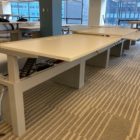 white Piper- Used Innovant Sit / Stand Trading Desks adjusted to various heights