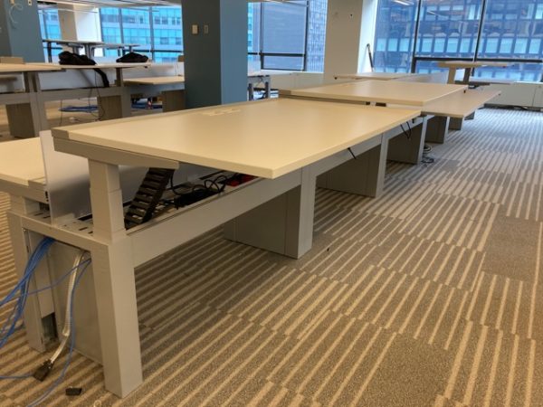 white Piper- Used Innovant Sit / Stand Trading Desks adjusted to various heights