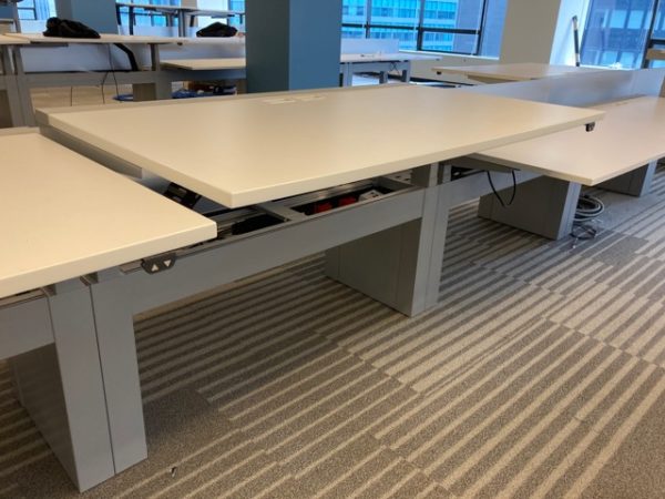 white Piper- Used Innovant Sit / Stand Trading Desks in office