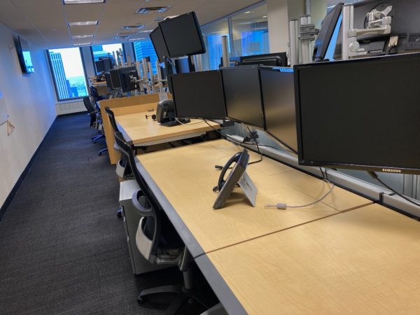 sit/stand desks in technical office adjusted to sit various sit heights